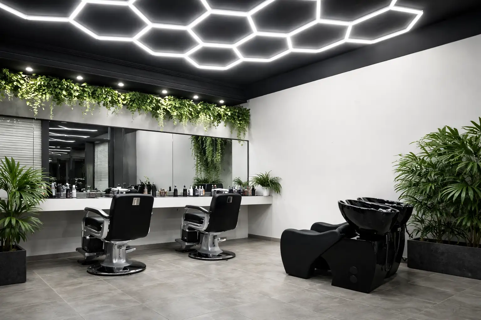 Interno del salone London Barber a Caselle Torinese con poltrone da barbiere, specchi e zona lavaggio